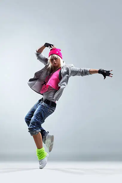 modern style dancer jumping on studio background