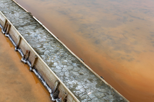 Levee at the salt flats pools filled with salt brine, detail