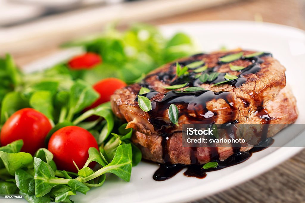 Fillet of beef with mixed salad. Balsamic Vinegar Stock Photo