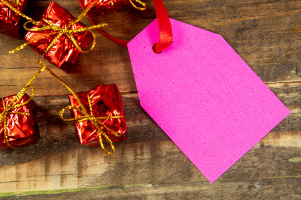 christmas decorative elements next to card with red ribbon and copy space