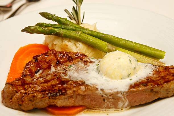 istock Strip Steak with Butter and Asparagus 154282686