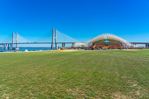 Main stage for the World Youth Days in the final stages of construction in front of the Vasco da Gama Bridge in Parque Tejo. Image captured on July 14, two weeks before the start of the event.