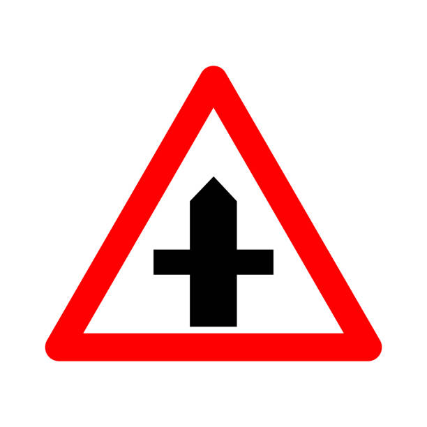 istock Intersection sign with secondary road. Warning sign. Red triangle sign with a silhouette of an intersection inside. Caution crossing with secondary road. Road sign. 1542851219