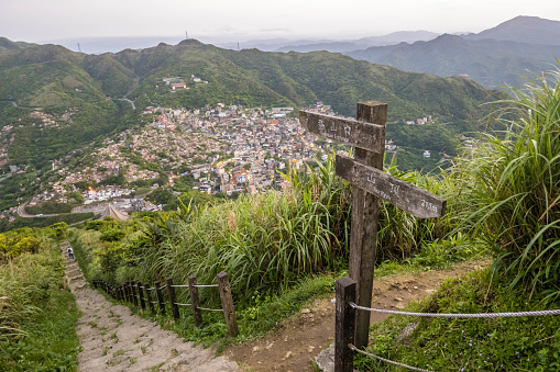 Sign on Mount Keelung Trail with view of Jiufen, New Taipei City, Taiwan.