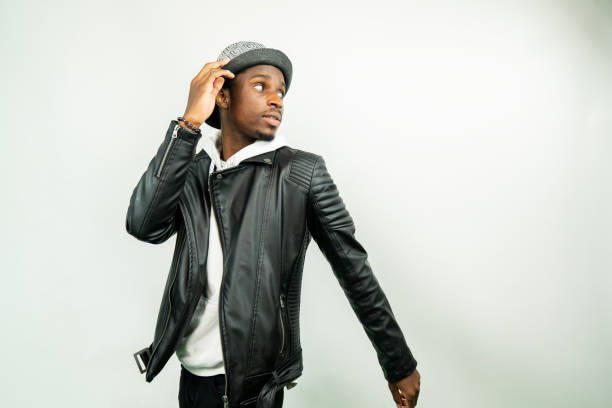 young black man standing against a white background