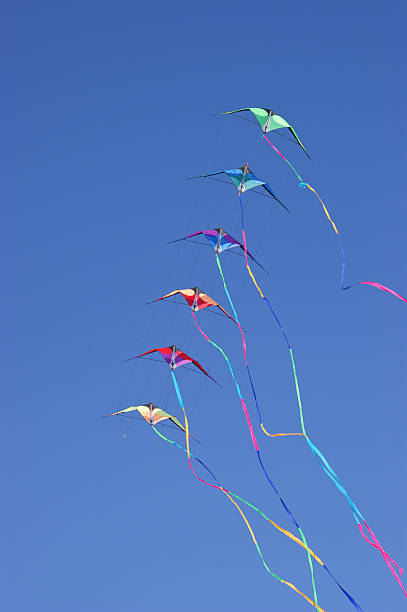 istock Kites against a vivid blue sky 154288348