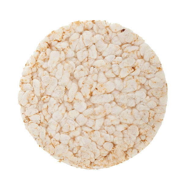 диета рисовая оладья коротким изолирован на белом - rice cake стоковые фото и изображения