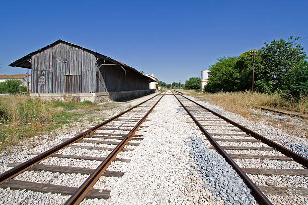 istock Converging tracks in an abandoned train station 154288938