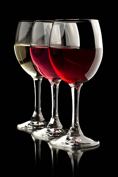 istock red, rose and white wine glasses in black background 154288967