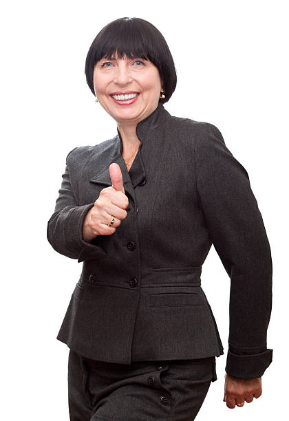 Smiling business woman showing thumb up. stock photo
