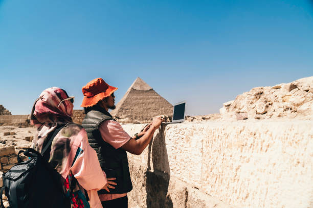istock Multiracial couple working on their laptops in giza area 1542932712