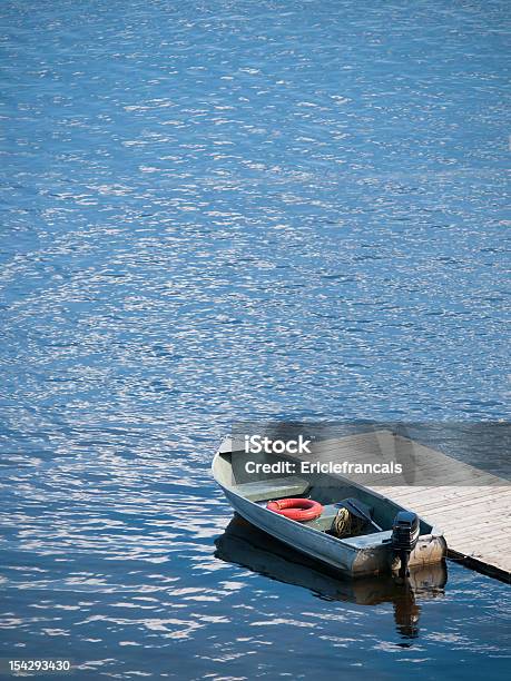 Small Boat Waits At A Wooden Dock Stock Photo - Download Image Now - Lake, Nautical Vessel, No People