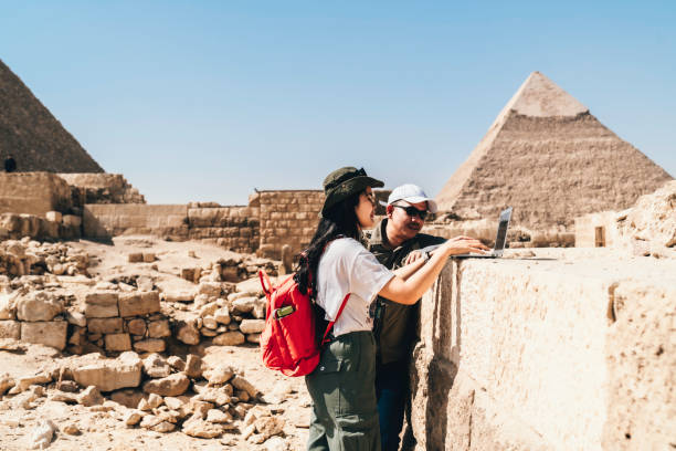 istock Multiracial couple working on their laptops in giza area 1542935931