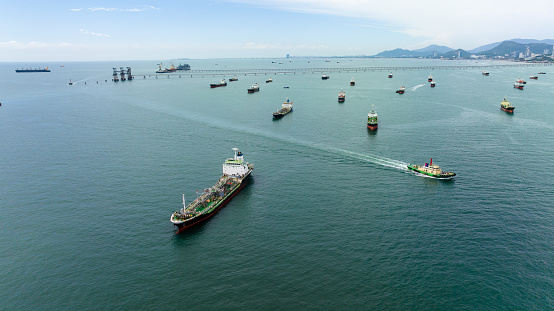Aerial view tanker ship anchor parking in sea, Crude oil tanker ship and GAS, LPG tanker ship loading in bay, business and industry about transportation, fuel and energy waste,