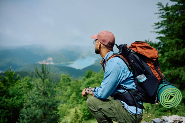 istock Hiker enjoying in a view from mountain peak. 1542955751