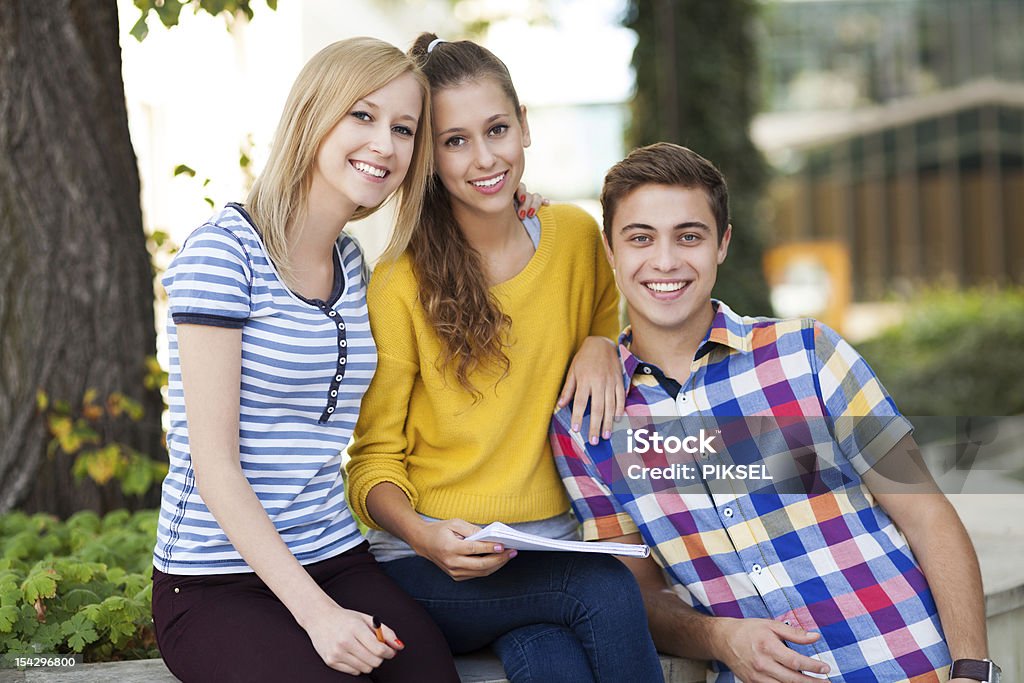 Three young people smiling Adult Stock Photo