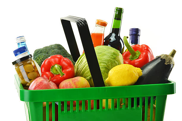istock Groceries in plastic shopping basket isolated on white 154297208