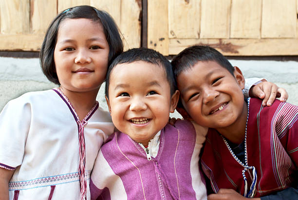istock Three children smiling for a photo 154299774