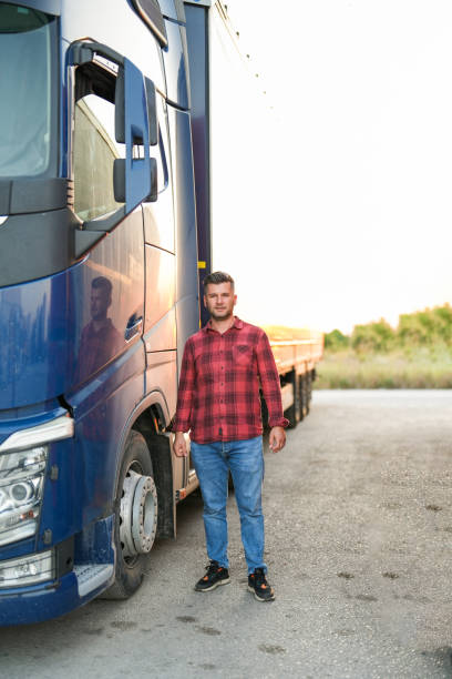 istock the driver posing next to the truck 1543008300