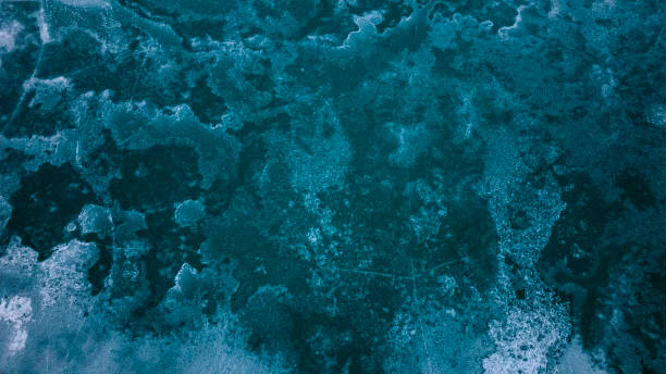 istock Ice crust on the surface of a mountain lake 1543019741