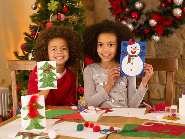 istock Mixed race children making Christmas cards 154304578