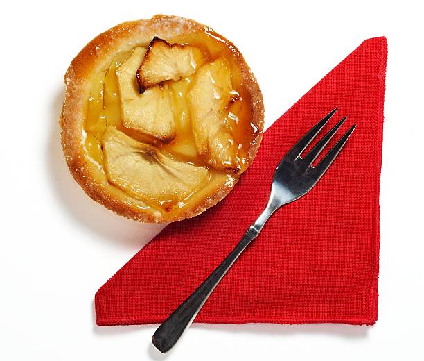 sweet apple with red napkin and fork stock photo