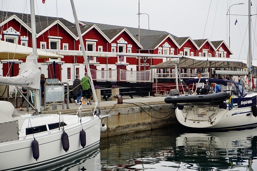 Skagen port in summer. Yachts parked in the port of Skagen. Reflection of yachts in the sea. Reflection of parked yachts in the water.