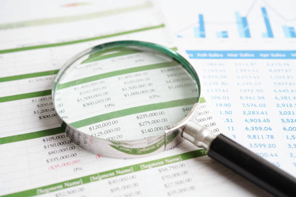 istock Magnifying glass on charts graphs paper. Financial development, Banking Account, Statistics, Investment Analytic research data economy. 1543078047