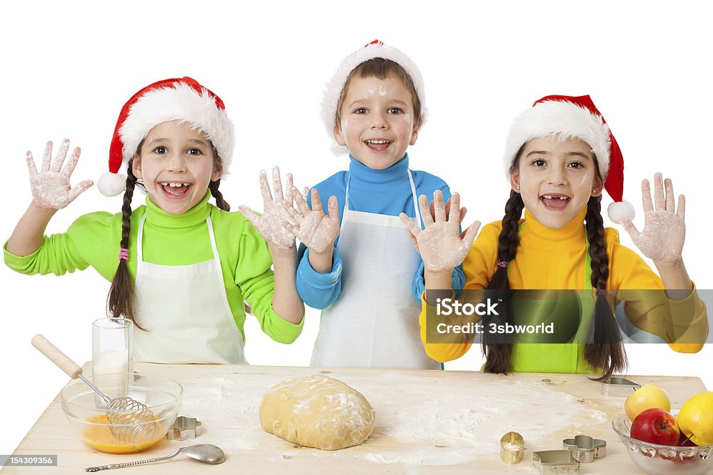 Três crianças com culinária de Natal - Foto de stock de Amizade royalty-free