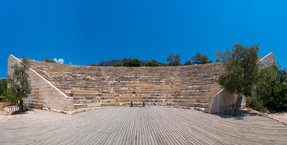 Panoramic view of ancient Greek theater in Antiphellos Ancient City. Antiphellus or Antiphellos known originally as Habesos, was an ancient coastal city in Lycia.