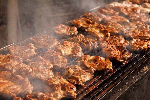istock Chicken steaks grilled at a summer picnic. 1543115669