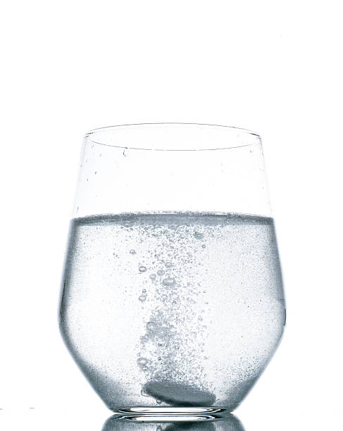 istock fizzy tablet in glass of water 154311734