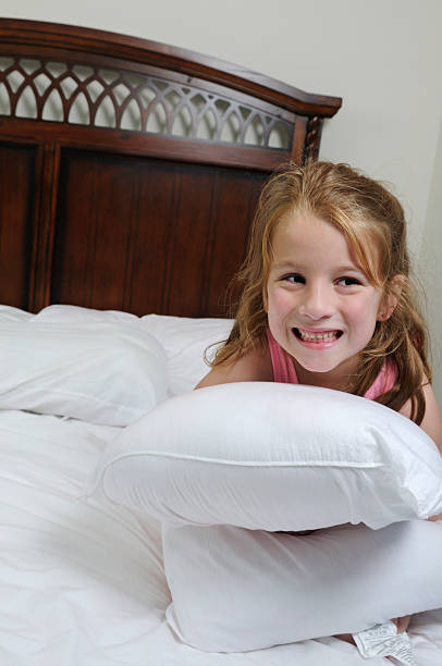 istock Young Girl Holds Pillow 154314091