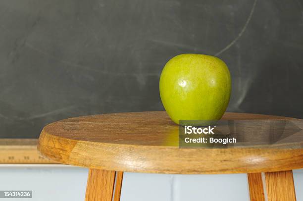 Green Apple In Front Of Chalkboard Stock Photo - Download Image Now - Apple - Fruit, Back to School, Backgrounds