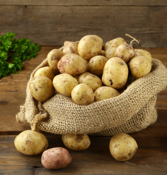 istock organic fresh potatoes on wooden table 1543161461