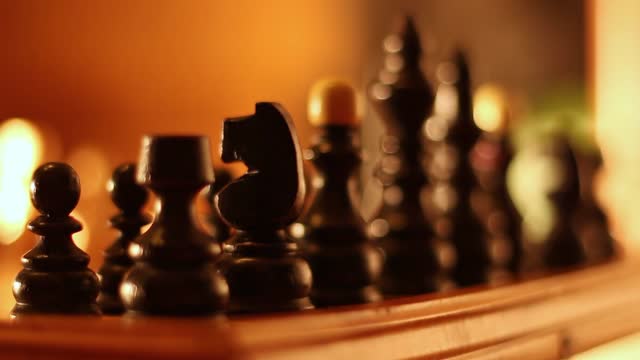 Black Chess Pieces On A Chess Board