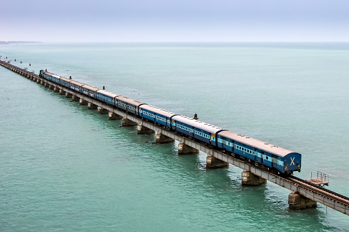 Rameshwaram to Tiruchirappalli passenger train crosses 2 kilometers long Pamban sea railway bridge, India.