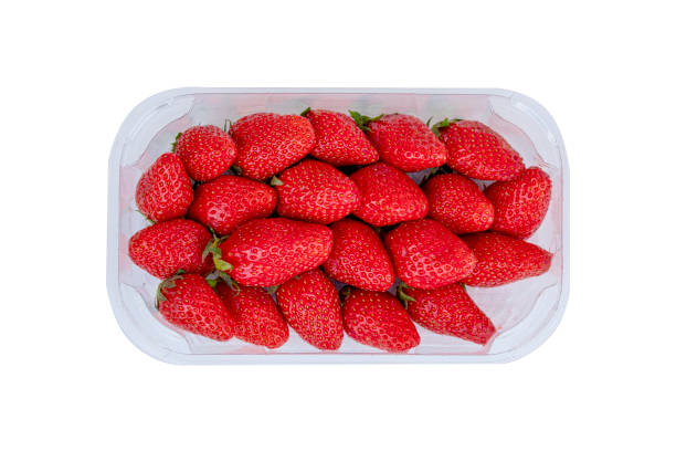 istock fruit strawberry in plastic box on white background. 1543184243