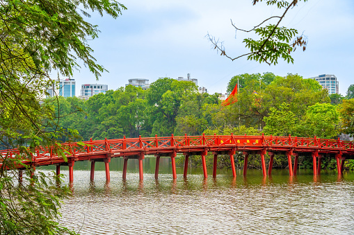 view of The Huc Red Bridge and Ngoc Son temple in the center of Hoan Kiem Lake, Ha Noi, Vietnam. Famous destination of Vietnam