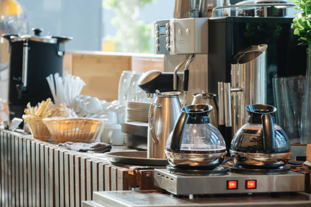 istock Close-up Woman 's hand preparing fresh aromatic coffee with modern automatic machine 1543203614