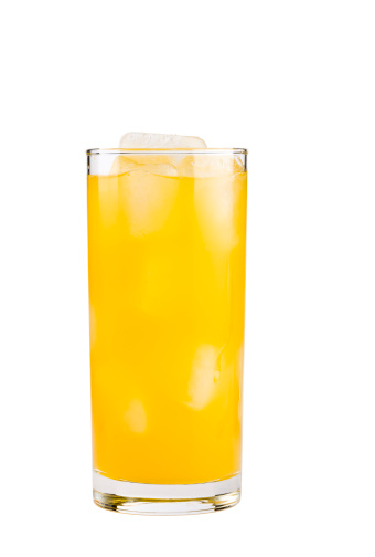 Yellow drink with ice cubes in highball glass isolated on white background