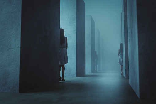 Spooky women standing in concrete maze. 3D generated image.