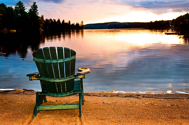 istock Wooden chair at sunset on beach 154326718
