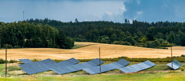 istock Countryside landscape with cluster of solar panels 1543354769