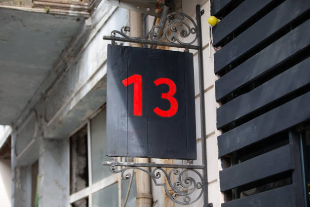 istock House number thirteen is written in red paint on a black background. Baker's dozen. 1543366808