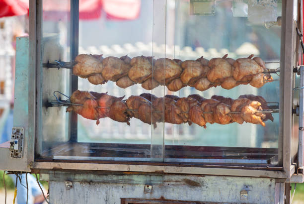 Chickens are cooking on the street, Asian street food.Saigon city - Vietnam.