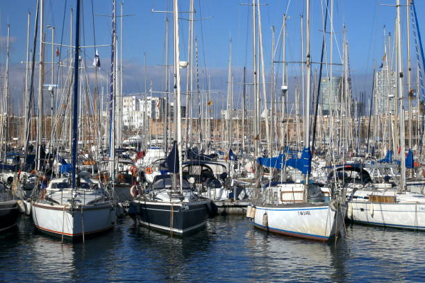 03/17/2015 Barcelona, Spain: The picture captures boats in Port Vell, Barcelona. The boats fill the marina, creating a charming scene against the backdrop of the city's skyline. The image showcases the diversity of vessels, from small fishing boats to luxurious yachts. It provides a glimpse into the bustling maritime activities that take place in this vibrant port.