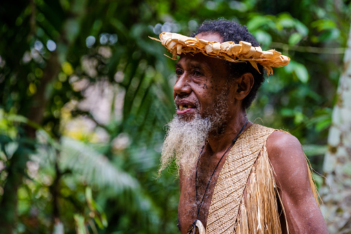 Vanuatu--Feb 15, 2023. A close-up photo of a village chief as he addresses a crowd of curios tourists.
