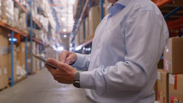 istock Tablet, hands and manager in warehouse for factory distribution, cargo manufacturing and production. Closeup of person, digital technology app and check online stock, logistics or wholesale inventory 1543428621