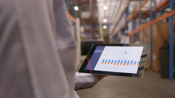 istock Hand, tablet and logistics in warehouse, factory and chart for data analysis, stats and commerce for stock. Digital touchscreen app, storage and shipping employee with information, cargo and freight 1543430019